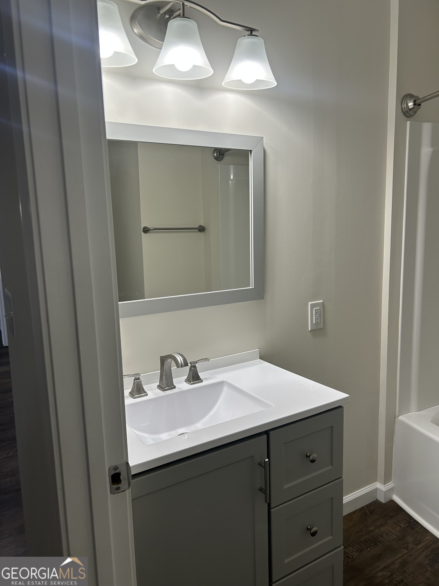 360 Warren Road Northeast Rome, GA 30165 - Photo 6 of 14 a bathroom with a sink and a mirror