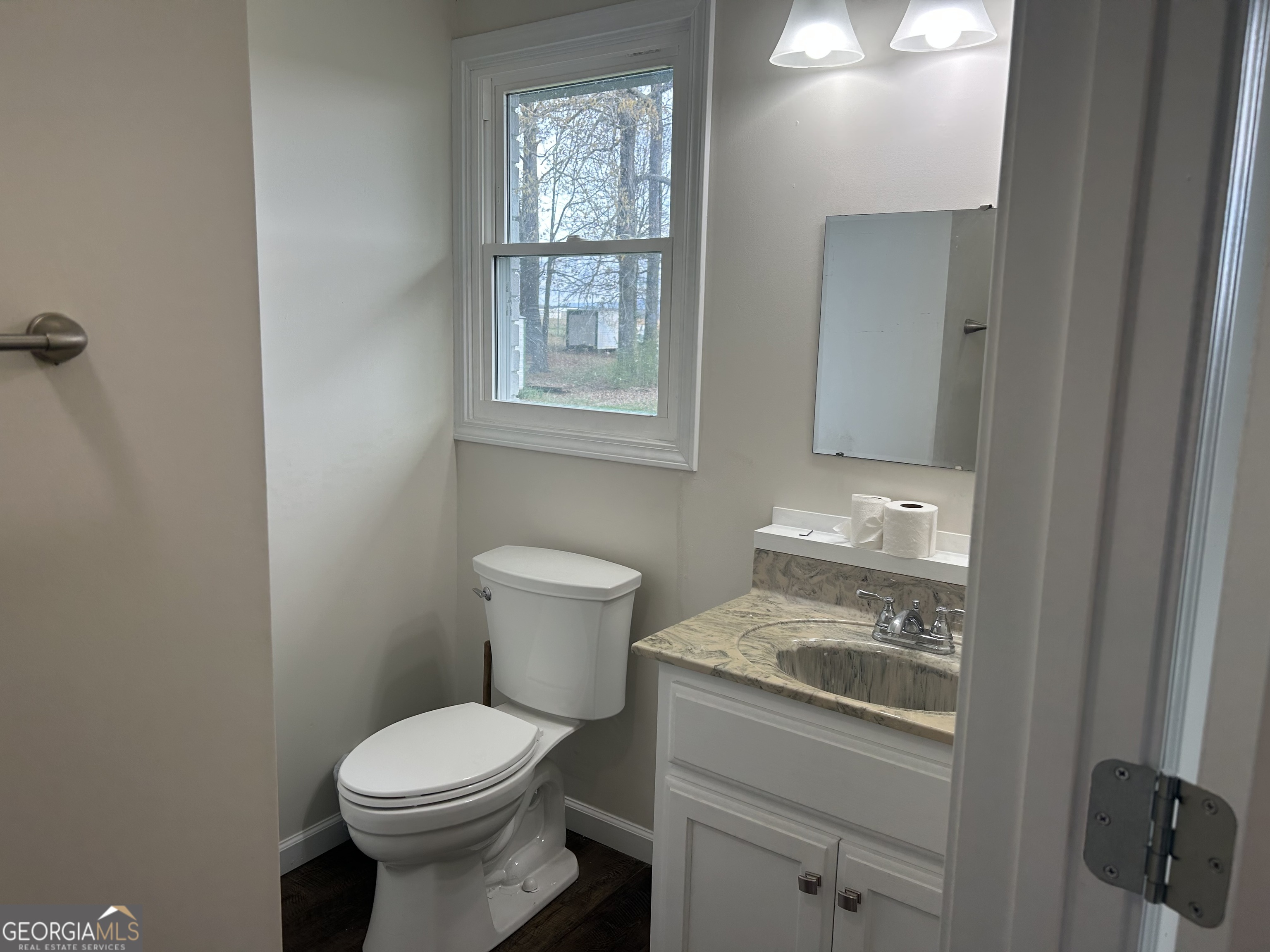 360 Warren Road Northeast Rome, GA 30165 - Photo 7 of 14 a bathroom with a toilet sink and mirror