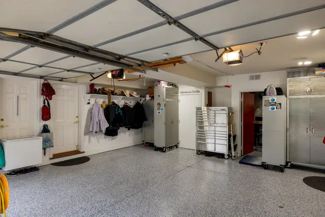 a view of a big room with air conditioner duct and materials on floor