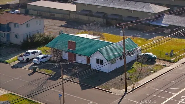 an aerial view of a house with a swimming pool
