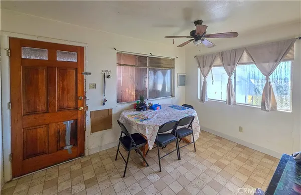 a dining room with a table chairs and a chandelier