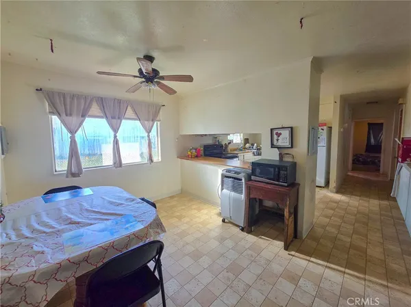 a kitchen with a table and chairs