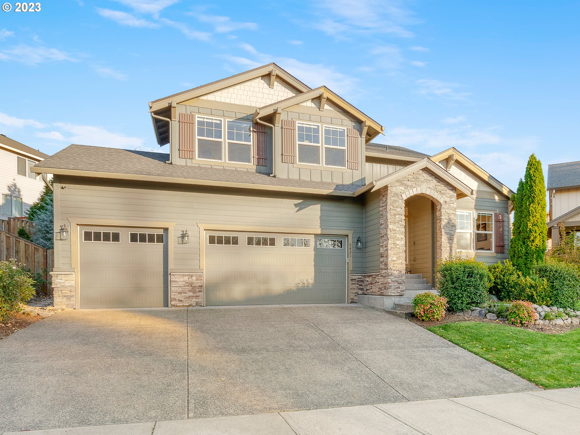 5420 Northwest 15th Circle Camas, WA 98607 - Photo 1 of 29 a view of a white house with a yard and garage
