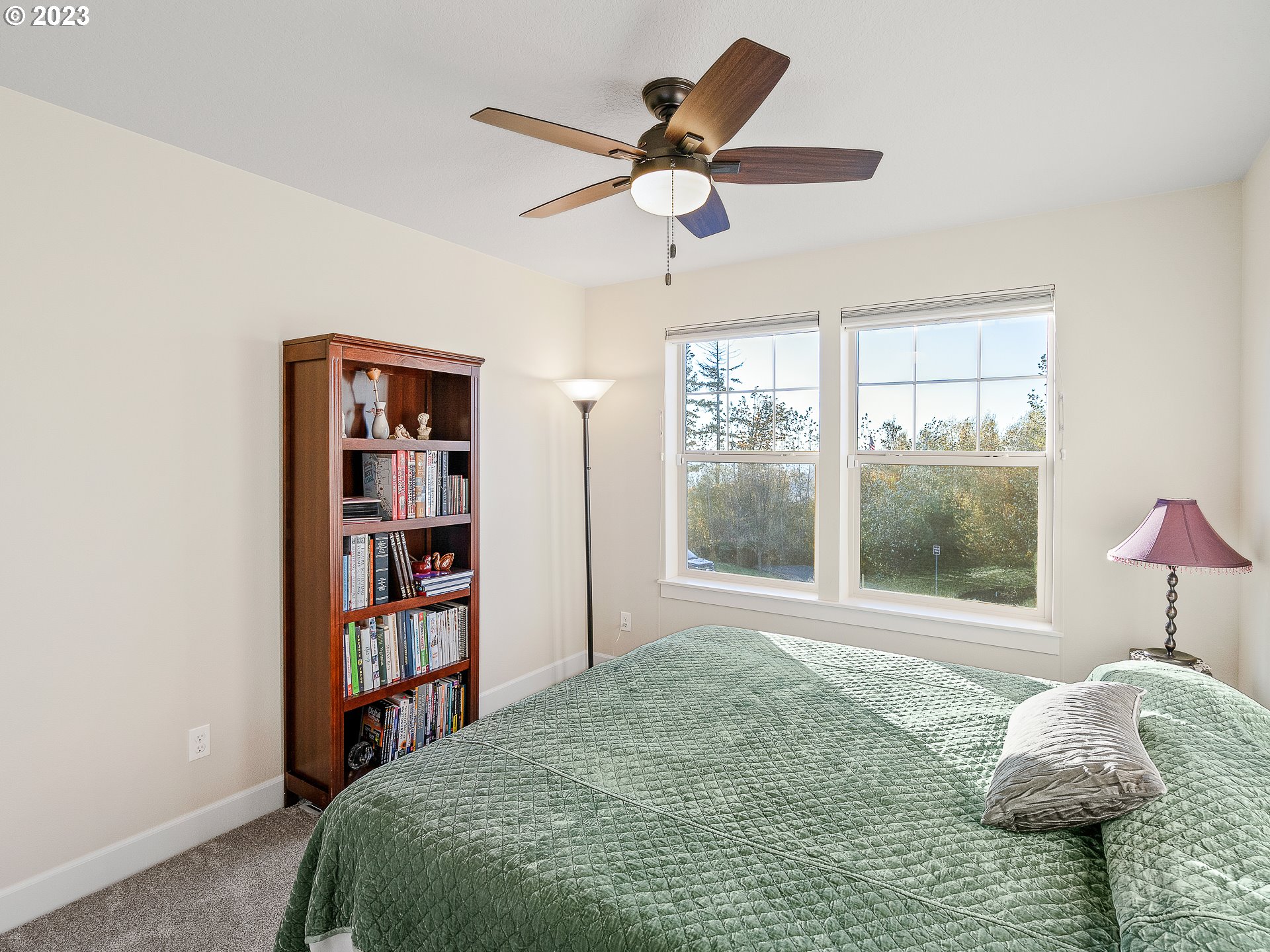 5420 Northwest 15th Circle Camas, WA 98607 - Photo 19 of 29 a bedroom with a bed a large window and a chandelier