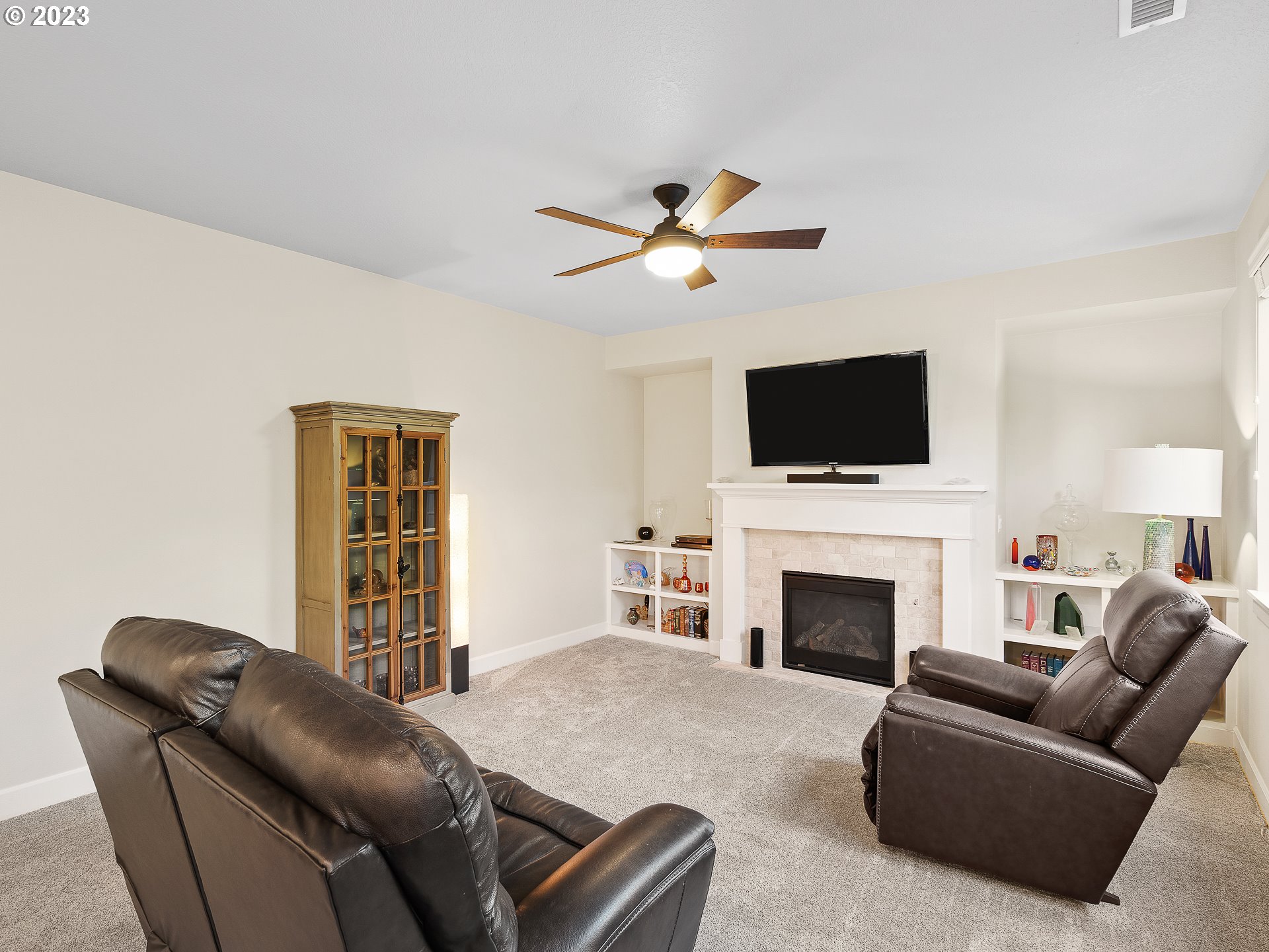 5420 Northwest 15th Circle Camas, WA 98607 - Photo 7 of 29 a living room with furniture a fireplace and a flat screen tv