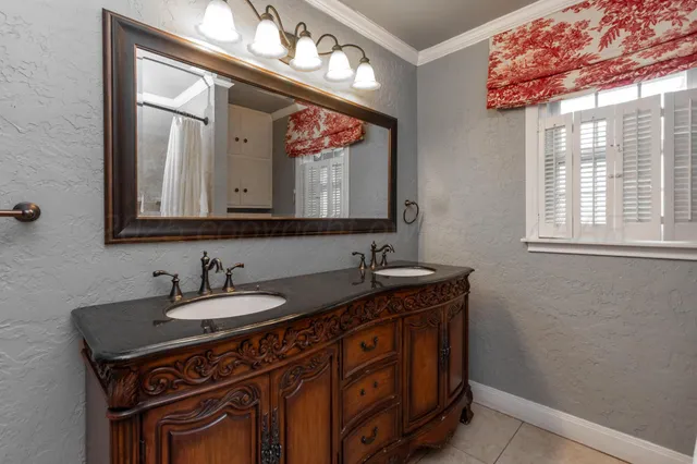 a bathroom with a sink a vanity and a mirror