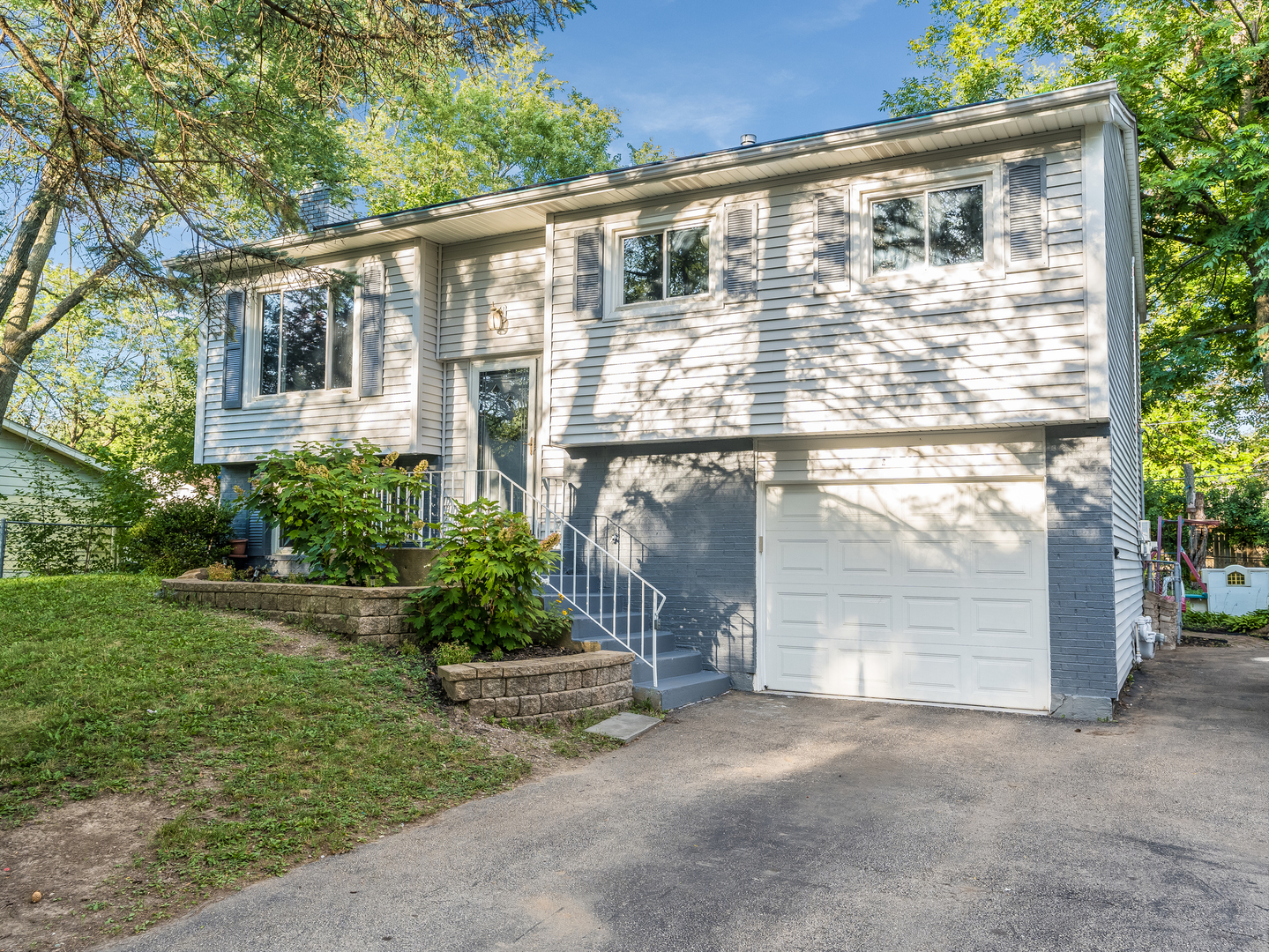 156 Bedford Road Bolingbrook, IL 60440 - Photo 1 of 16 a front view of a house with a yard and garage