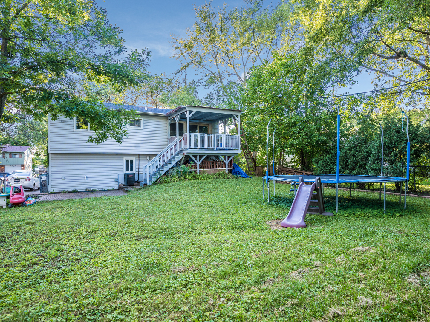 156 Bedford Road Bolingbrook, IL 60440 - Photo 16 of 16 a view of a backyard with a slide and a slide