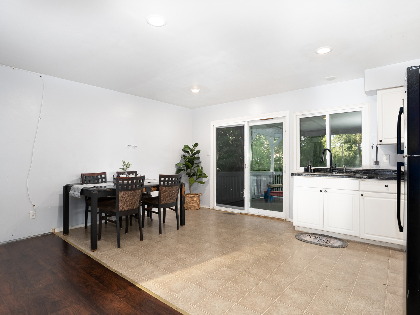 156 Bedford Road Bolingbrook, IL 60440 - Photo 4 of 16 a view of a dining room with furniture window and wooden floor