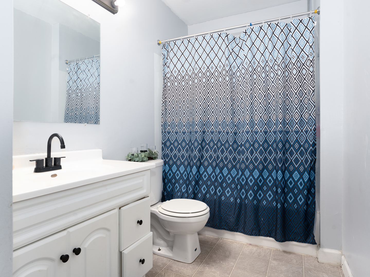 156 Bedford Road Bolingbrook, IL 60440 - Photo 7 of 16 a bathroom with a toilet sink and mirror