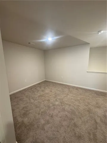 an empty room with a natural light