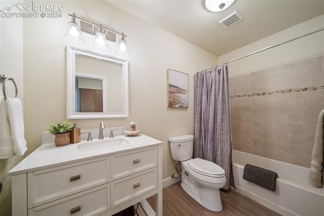 263 Southpark Road Highlands Ranch, CO 80126 - Photo 28 of 42 Main floor guest bathroom has been fully updated with vanity, fixtures, tile and lighting