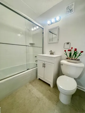 a bathroom with a toilet a sink and a bathtub