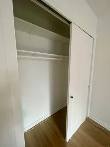 a view of front door with wooden floor