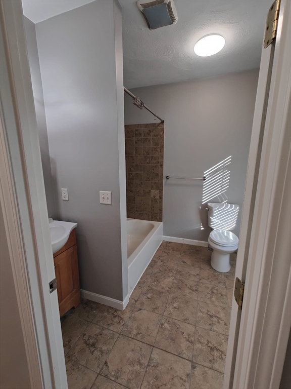 30 Vine Street, Unit 2 Haverhill, MA 01830 - Photo 2 of 13 a bathroom with a toilet and a shower