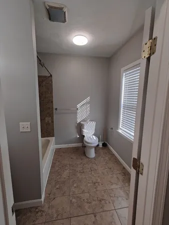 a bathroom with a toilet