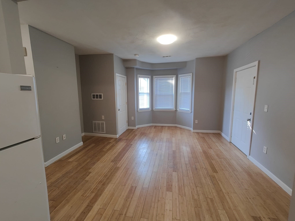 30 Vine Street, Unit 2 Haverhill, MA 01830 - Photo 7 of 13 a view of wooden floor and windows in a room