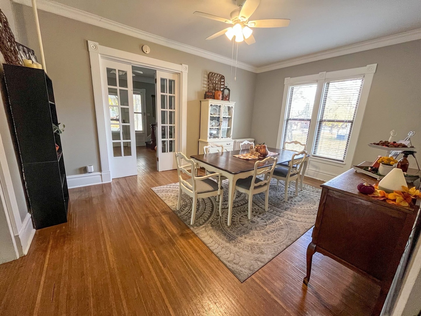 340 South Main Street Sheffield, IL 61361 - Photo 9 of 32 a dining room with wooden floor a glass table and chairs