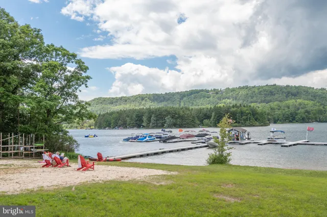 a view of a swimming pool with a table and chairs
