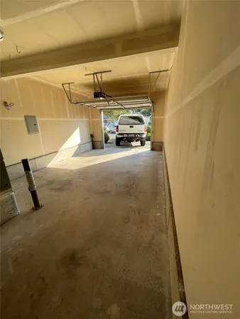 an aerial view of a house with a yard and a tub