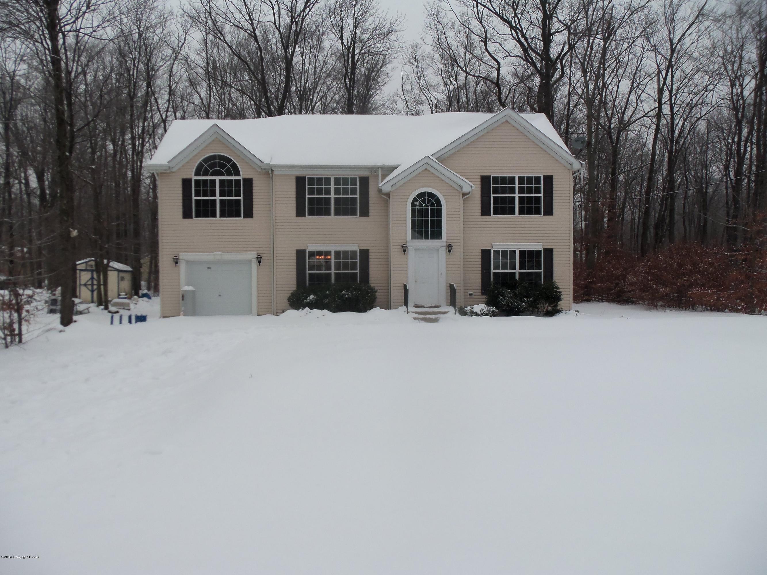 4153 Romeo Road Tobyhanna, PA 18466 - Photo 1 of 41 a view of a white house with a yard covered in snow