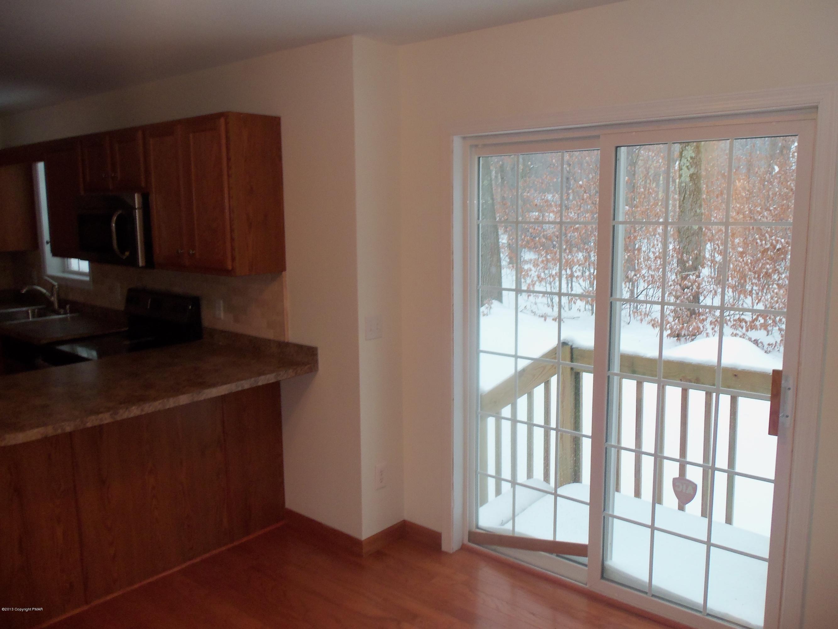 4153 Romeo Road Tobyhanna, PA 18466 - Photo 15 of 41 a kitchen with a window a sink and a counter top space