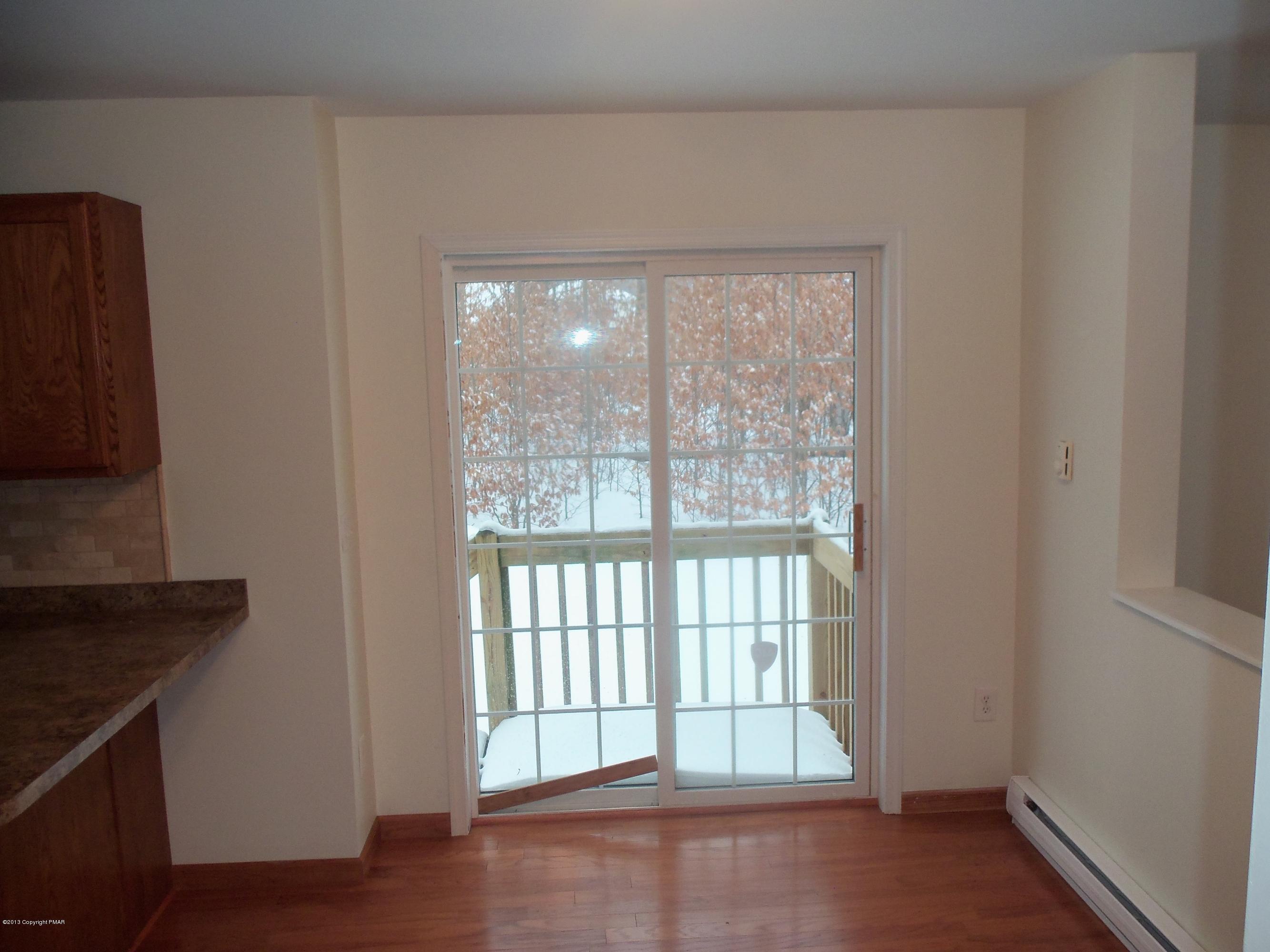 4153 Romeo Road Tobyhanna, PA 18466 - Photo 16 of 41 a view of an empty room with wooden floor and a window