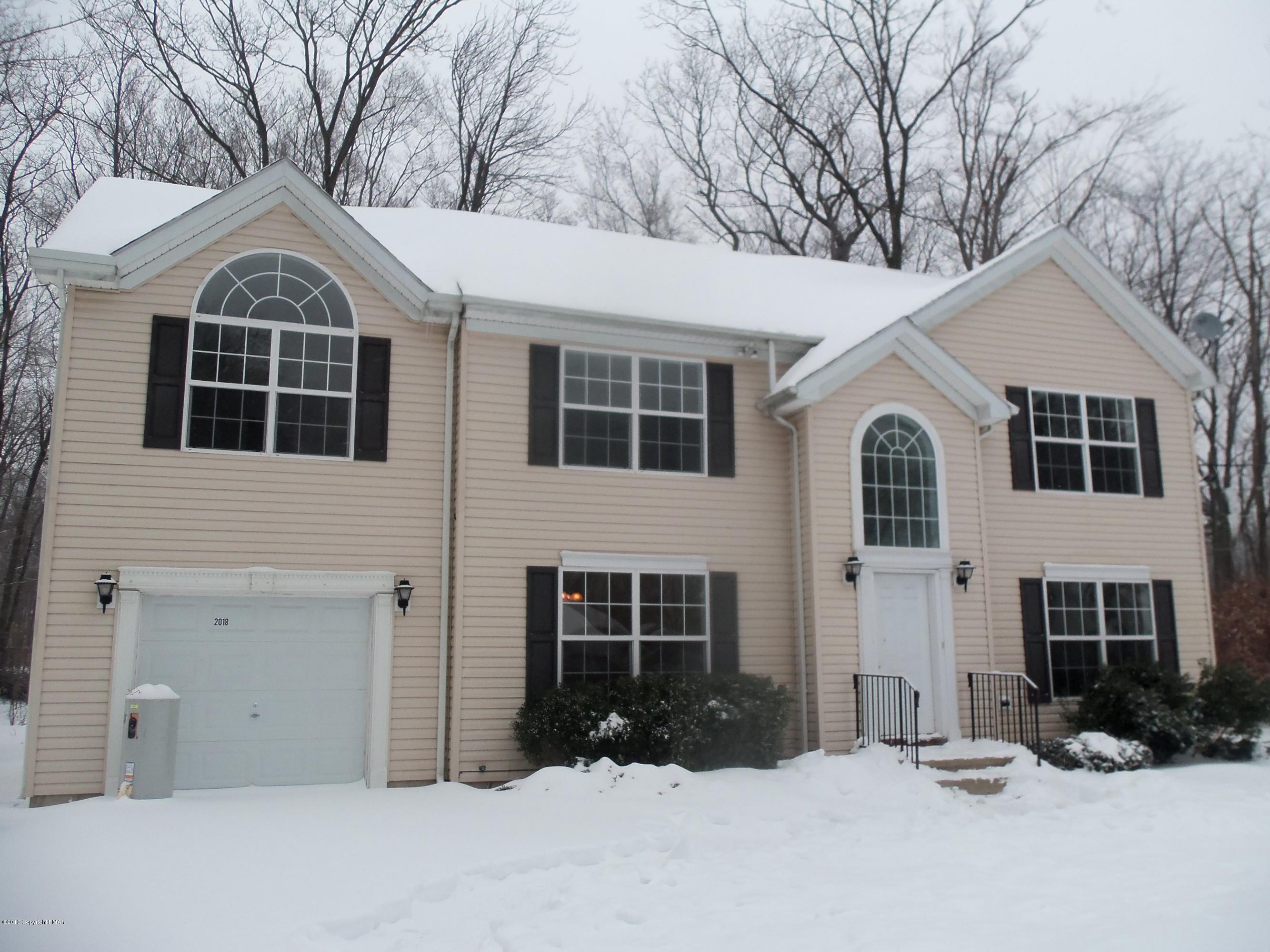4153 Romeo Road Tobyhanna, PA 18466 - Photo 2 of 41 a front view of a house with a yard
