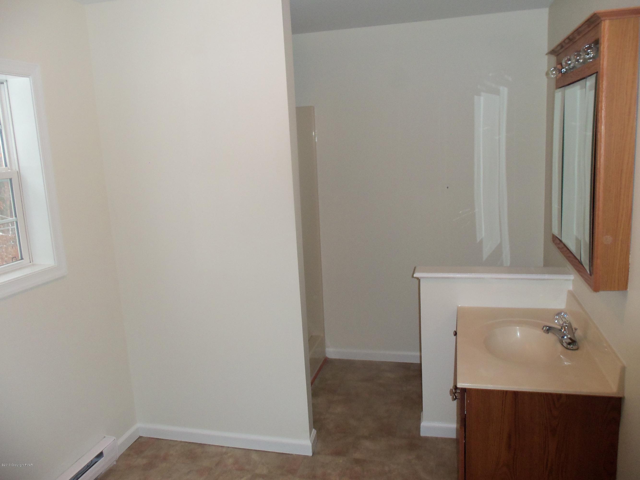4153 Romeo Road Tobyhanna, PA 18466 - Photo 37 of 41 a bathroom with a sink and a mirror