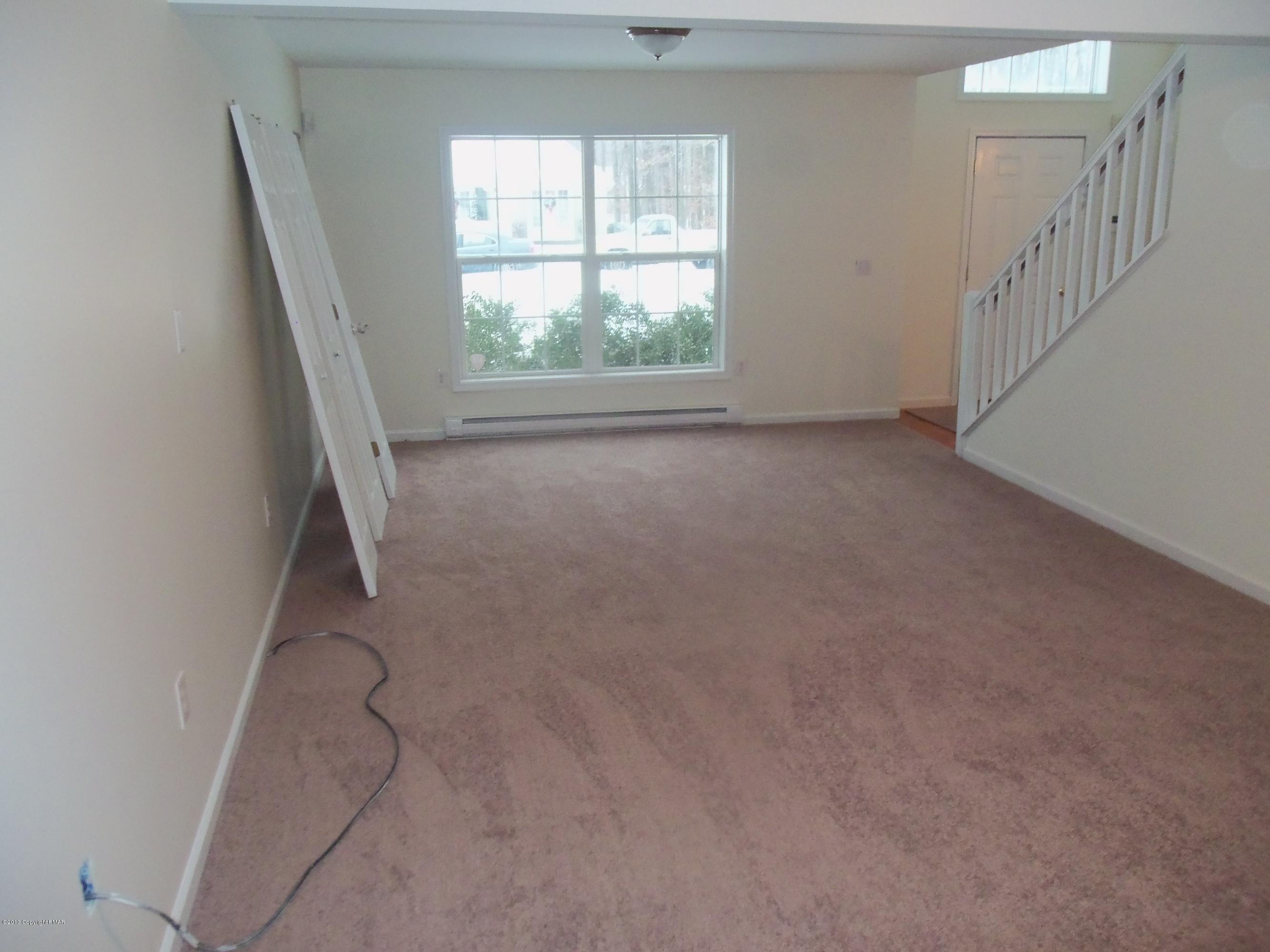 4153 Romeo Road Tobyhanna, PA 18466 - Photo 4 of 41 a view of room with stairs and a window