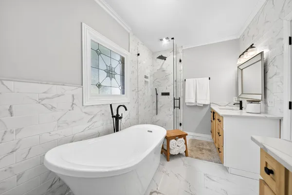 a bathroom with a toilet a sink and a bathtub