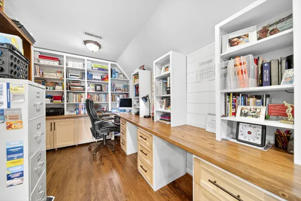 a view of a livingroom with furniture and a large window
