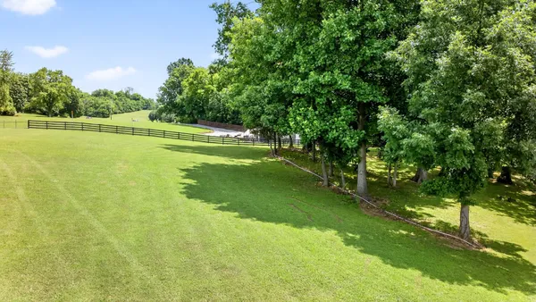 a view of backyard with outdoor seating