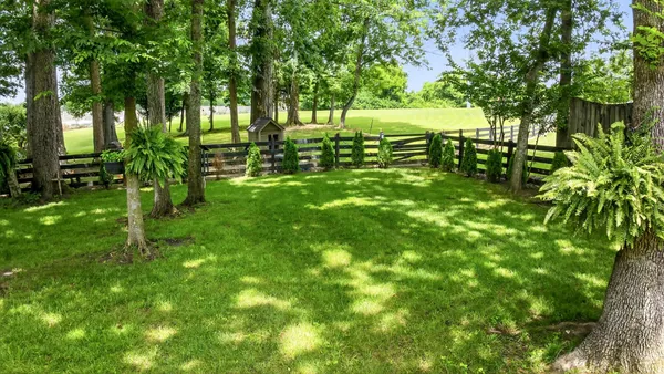 a view of a balcony with chair and floor to ceiling window