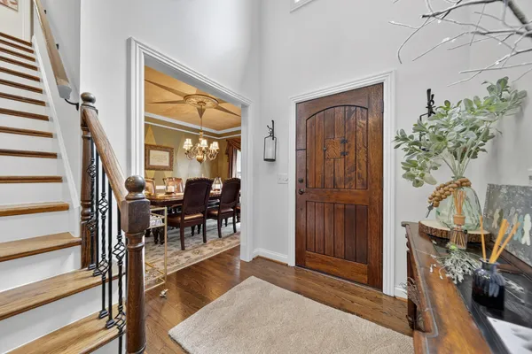a view of living room filled with furniture and entryway