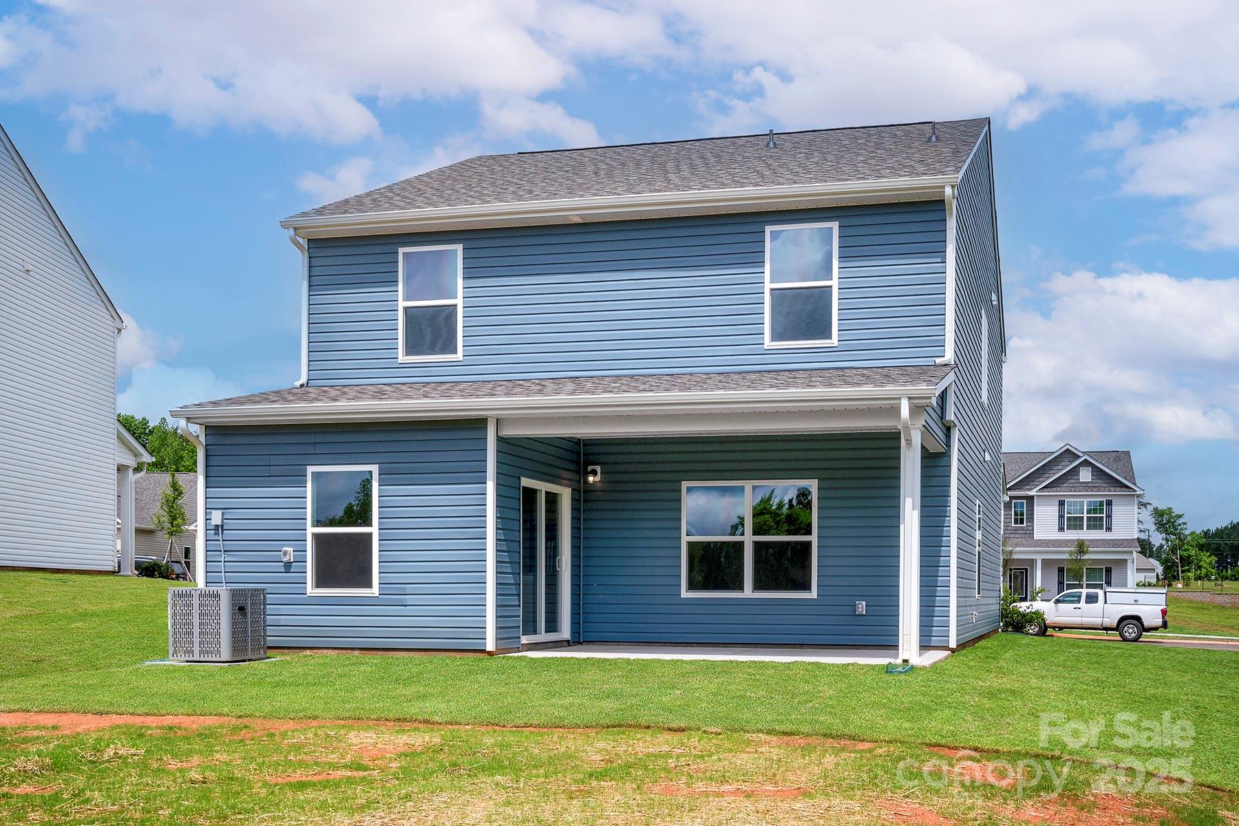 7117 Jerimoth Drive Charlotte, NC 28215 - Photo 2 of 12 a front view of a house with a yard
