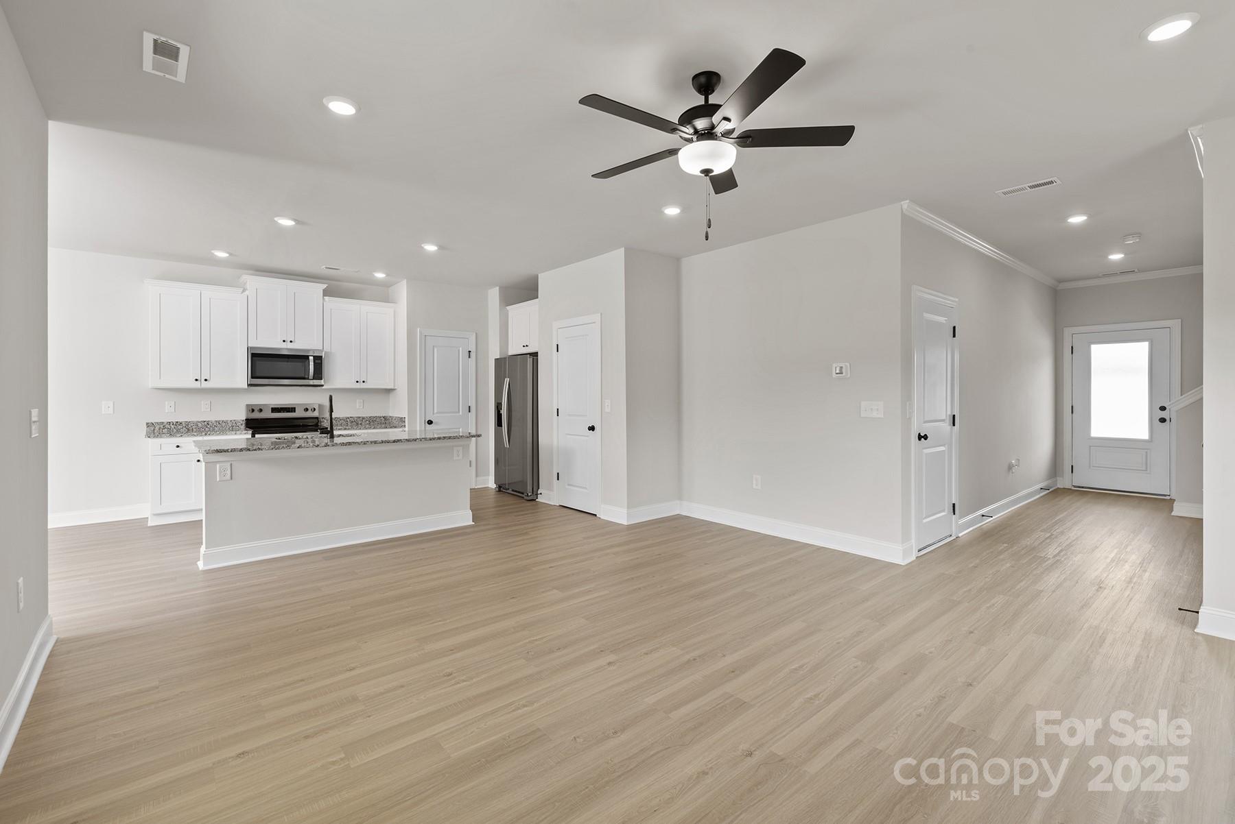 7117 Jerimoth Drive Charlotte, NC 28215 - Photo 3 of 12 a view of a kitchen with a sink and a refrigerator
