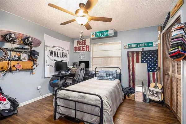 a bedroom with furniture and a chandelier