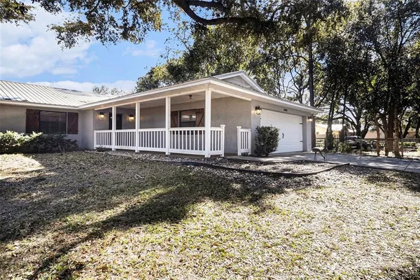 a house with a large tree in front of it
