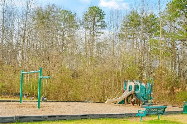 a view of a park with large trees