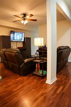 a living room with furniture and a mirror