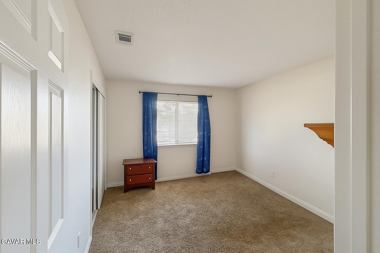 16549 Mossdale Avenue Lake Los Angeles, CA 93535 - Photo 13 of 23 a view of an empty room with a window