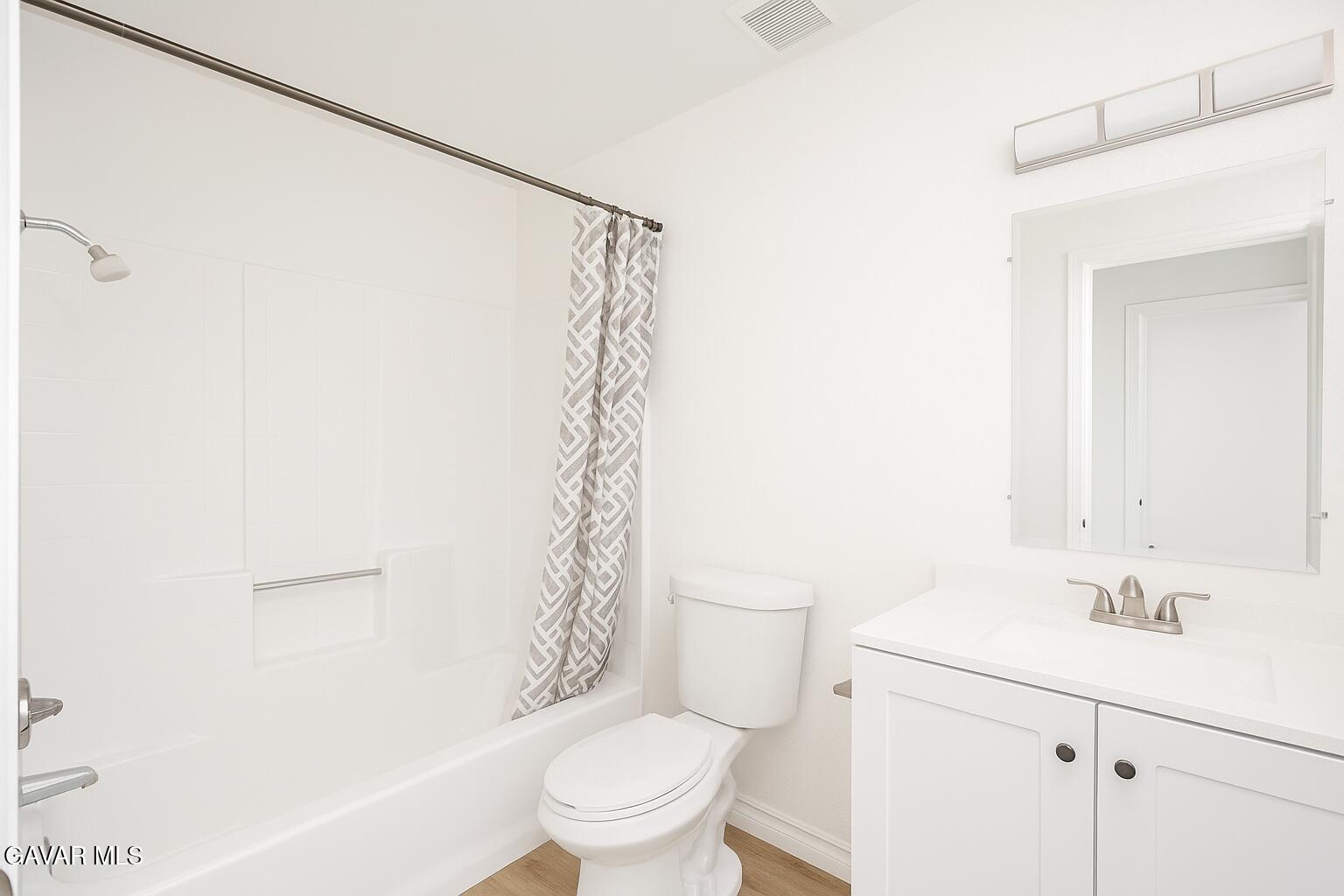16549 Mossdale Avenue Lake Los Angeles, CA 93535 - Photo 10 of 23 a bathroom with a sink a toilet and shower