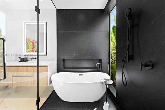 a bathroom with a bathtub and a sink