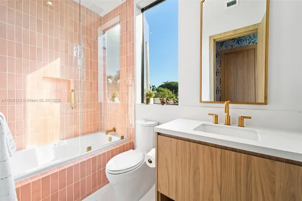 a bathroom with a sink a toilet and a bathtub
