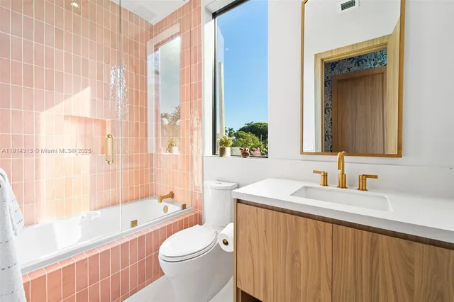 a bathroom with a sink a toilet and a bathtub