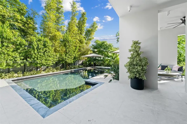 a view of a house with a yard and garden