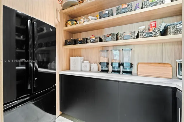 a kitchen with wooden cabinets