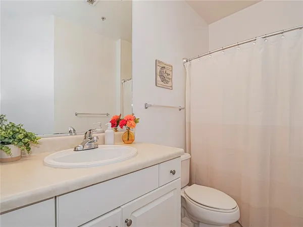 a bathroom with a sink toilet and vanity