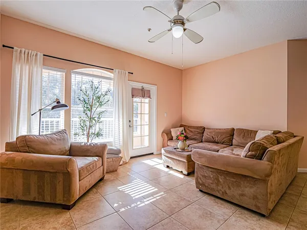 a living room with furniture and a large window